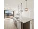 Modern kitchen featuring granite countertops, dark wood cabinets, and stainless steel appliances at 22489 W Pontiac Dr, Surprise, AZ 85387
