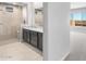 Modern bathroom boasts a sleek vanity, walk-in shower, and neutral color palette at 24691 N 169Th Ave, Surprise, AZ 85387