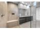 This bathroom showcases walk-in shower with bench, sleek vanity, and modern fixtures at 24691 N 169Th Ave, Surprise, AZ 85387