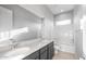 Bathroom featuring double sinks with granite countertops and a tub shower combo at 24691 N 169Th Ave, Surprise, AZ 85387