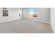 Spacious bedroom with neutral carpeting, ample natural light, and calming color scheme at 24691 N 169Th Ave, Surprise, AZ 85387