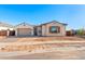 Charming single-story home featuring a two-car garage, tile roof, and neutral-toned stucco exterior at 24691 N 169Th Ave, Surprise, AZ 85387