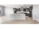 Spacious kitchen with gray cabinets, stainless steel appliances, and a large center island at 24691 N 169Th Ave, Surprise, AZ 85387