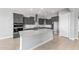 Gourmet kitchen featuring modern gray cabinetry, stainless steel appliances, and a spacious island at 24691 N 169Th Ave, Surprise, AZ 85387