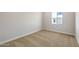 This bedroom features neutral carpet, light walls, a window, and white trim at 24707 N 169Th Ave, Surprise, AZ 85387