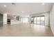 Expansive open floor plan connecting the kitchen and living room, filled with natural light at 24707 N 169Th Ave, Surprise, AZ 85387