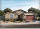 New craftsman style home with a two-car garage and desert landscaping at 2619 E Santa Ynez Dr, Casa Grande, AZ 85194