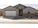 Modern one-story home with attached garage and stone accents at 2625 E Santa Ynez Dr, Casa Grande, AZ 85194