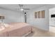 Bedroom with ceiling fan and access to bathroom at 2727 N 20Th Dr, Phoenix, AZ 85009