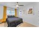 Cozy bedroom with mustard yellow curtains and wood nightstand at 2727 N 20Th Dr, Phoenix, AZ 85009
