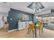 Bright dining area with yellow chairs and view of the kitchen at 2727 N 20Th Dr, Phoenix, AZ 85009