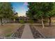 Charming ranch house with a stone pathway and lush landscaping at 2727 N 20Th Dr, Phoenix, AZ 85009