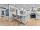 Renovated kitchen featuring white cabinets and quartz countertops at 2727 N 20Th Dr, Phoenix, AZ 85009