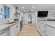 Modern kitchen with white cabinets, stainless steel appliances and an island at 2727 N 20Th Dr, Phoenix, AZ 85009