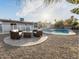 Resort-style backyard features a sparkling pool, patio seating, and lush landscaping at 2804 W Curry St, Chandler, AZ 85224