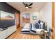 The staged bedroom is complete with hardwood floors, a ceiling fan, and a comfortable bed at 2804 W Curry St, Chandler, AZ 85224