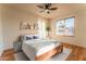 Spacious bedroom with large window and wood-like flooring at 2804 W Curry St, Chandler, AZ 85224