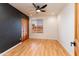 Empty bedroom features hardwood floors, recessed lighting, and a view of the neighborhood at 2804 W Curry St, Chandler, AZ 85224