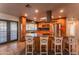 Kitchen with granite island, stainless steel appliances, and access to backyard at 2804 W Curry St, Chandler, AZ 85224