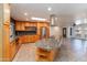 Expansive kitchen with granite counters, wooden cabinets, stainless appliances, and a huge granite island at 2804 W Curry St, Chandler, AZ 85224