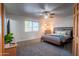 Main bedroom featuring a ceiling fan and plush carpeting at 2804 W Curry St, Chandler, AZ 85224