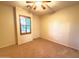 Bright bedroom with window shutters and carpet flooring at 3510 E Lafayette Ave, Gilbert, AZ 85298