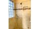 Tiled shower with glass enclosure and built-in shelving at 3510 E Lafayette Ave, Gilbert, AZ 85298