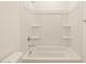 Bright bathroom showcasing a pristine white bathtub and shower combo at 37013 W La Paz St, Maricopa, AZ 85138