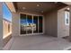 Covered patio with sliding glass doors offering an outdoor space at 40548 W Wade Dr, Maricopa, AZ 85138