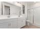 Modern bathroom with double vanity and shower at 40548 W Wade Dr, Maricopa, AZ 85138