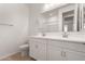 Modern bathroom with double vanity and walk-in shower at 40548 W Wade Dr, Maricopa, AZ 85138
