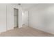 Spacious bedroom with carpet flooring and closet at 40548 W Wade Dr, Maricopa, AZ 85138