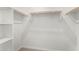 Walk-in closet with shelves and hanging rods at 40548 W Wade Dr, Maricopa, AZ 85138