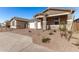 One story home with a white two-car garage and landscaping at 40548 W Wade Dr, Maricopa, AZ 85138