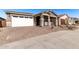 One story home with a white two-car garage and landscaping at 40548 W Wade Dr, Maricopa, AZ 85138