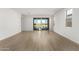 Bright living room with lake view and sliding glass doors at 40548 W Wade Dr, Maricopa, AZ 85138
