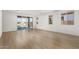 Living area with sliding doors opening to a lake view at 40548 W Wade Dr, Maricopa, AZ 85138
