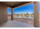 Spacious backyard patio overlooking a peaceful lake at 40548 W Wade Dr, Maricopa, AZ 85138