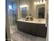 Bathroom with double vanity, modern lighting, and glass shower at 1406 W Main St # 140, Mesa, AZ 85201