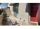 Inviting red front door with a 'Welcome' mat, complemented by a well-kept patio area at 1406 W Main St # 140, Mesa, AZ 85201