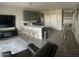 Open-concept living space featuring modern kitchen, dining area, and cozy living room at 1406 W Main St # 140, Mesa, AZ 85201