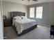 Spacious main bedroom with large bed and natural lighting at 1406 W Main St # 140, Mesa, AZ 85201