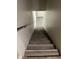 Staircase leading to upper floor with wood-style steps and modern railing at 1406 W Main St # 140, Mesa, AZ 85201