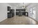 Modern kitchen with gray cabinets, granite counters, and island at 14171 N 131St Ln, Surprise, AZ 85379