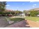 Inviting backyard featuring a kidney shaped pool, lush landscaping, and patio space at 14430 N Prickly Pear Ct, Fountain Hills, AZ 85268