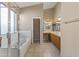 Bright bathroom features a large soaking tub, vanity and shower with glass door at 14430 N Prickly Pear Ct, Fountain Hills, AZ 85268