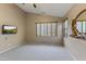 Neutral bedroom with a vaulted ceiling, ceiling fan, and a mounted television set at 14430 N Prickly Pear Ct, Fountain Hills, AZ 85268