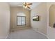 Bright bedroom with vaulted ceilings, a large window, ceiling fan and mounted TV at 14430 N Prickly Pear Ct, Fountain Hills, AZ 85268