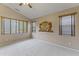 Light bedroom showcasing a large decorative mirror, vaulted ceilings, and great natural light at 14430 N Prickly Pear Ct, Fountain Hills, AZ 85268
