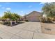 Charming single-story home with a well-manicured desert landscape and a spacious driveway at 14430 N Prickly Pear Ct, Fountain Hills, AZ 85268